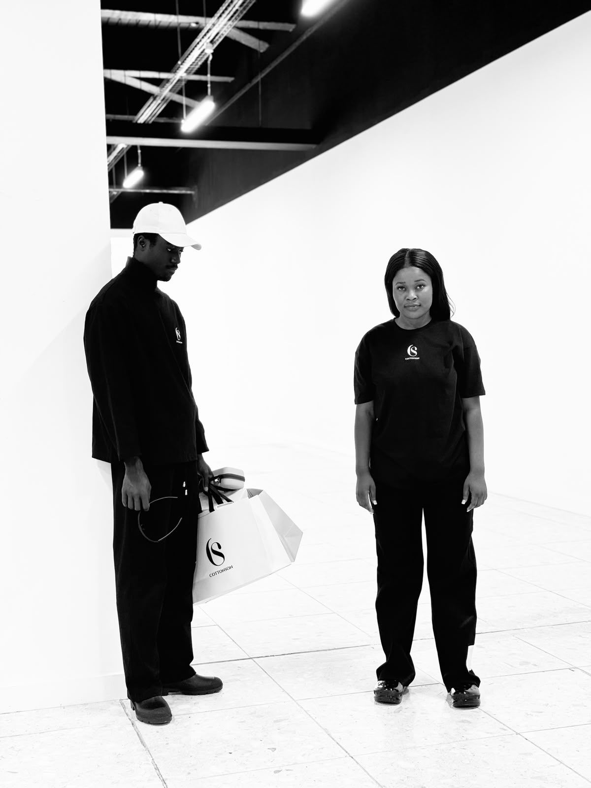 COTTONSON campaign: monochrome tailoring photographed against concrete